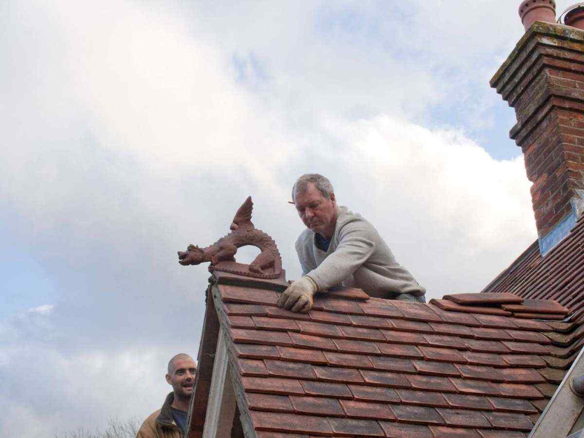 dragon-finial-being-installed-by-roofer